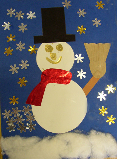 carte de Noël avec un bonhomme de neige fait de de ronds en papier