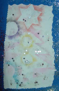 carte de noel faite avec des gabarits d'étoiles et des pastels gras